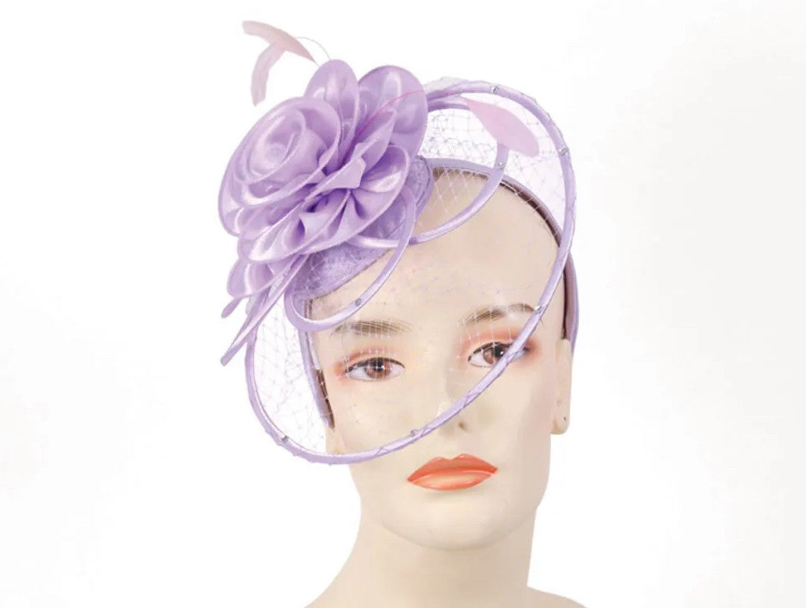 The Ferris Wheel fascinator is available in white, black, cream, lilac and yellow.